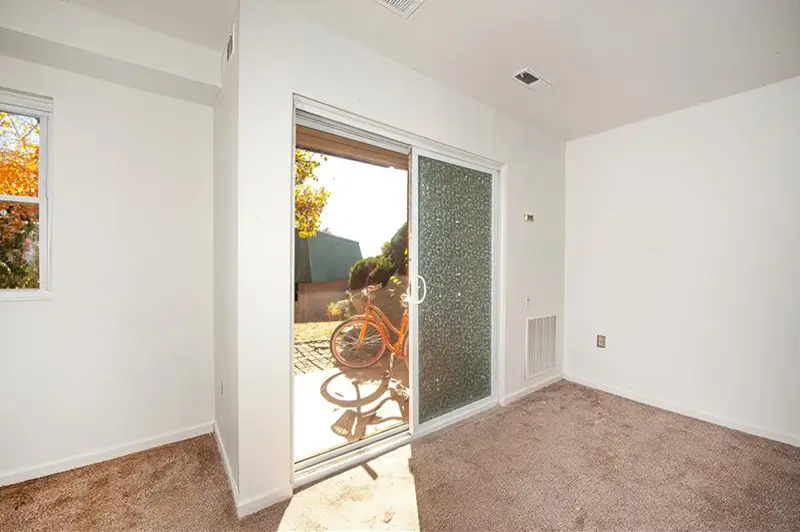 Living room with sliding doors to an outdoor common area - 519 Meadowview Lane